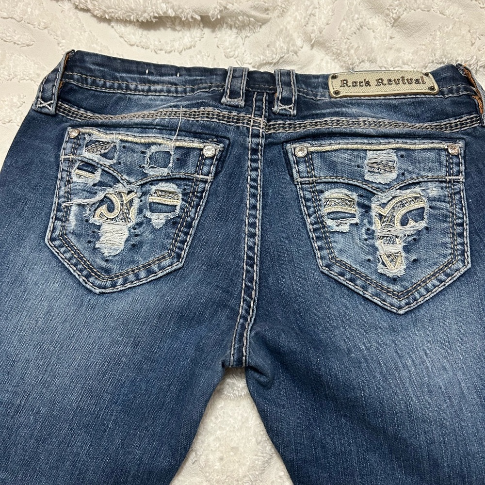Rock Revival Blue Boot Cut Jeans with Ornate Stitching
